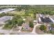 Aerial view of the property features land, buildings, greenhouses, and a residential area at 6957 Plymouth Sorrento Rd, Apopka, FL 32712
