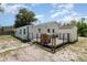 Backyard features a wooden deck, utility shed, and mature tree at 6957 Plymouth Sorrento Rd, Apopka, FL 32712