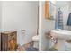 Full bathroom with a pedestal sink, wood cabinet, and shower at 6957 Plymouth Sorrento Rd, Apopka, FL 32712
