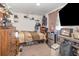 Bedroom includes a refrigerator, TV, dresser, and shelving at 6957 Plymouth Sorrento Rd, Apopka, FL 32712