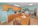 Functional eat-in kitchen with lots of cabinet space and a cozy dining area next to the cooking area at 6957 Plymouth Sorrento Rd, Apopka, FL 32712