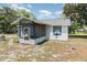 A charming single-story home with a screened front porch and a well-maintained exterior at 6957 Plymouth Sorrento Rd, Apopka, FL 32712