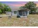 Charming single-story home with a screened-in porch and well-maintained exterior at 6957 Plymouth Sorrento Rd, Apopka, FL 32712