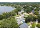 Aerial view of a lakeside community showcasing lush landscaping and a private in-ground pool at 7 Ne Ivanhoe Blvd, Orlando, FL 32804
