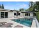 Beautiful backyard pool and patio area with outdoor kitchen, perfect for entertaining and relaxation at 7 Ne Ivanhoe Blvd, Orlando, FL 32804