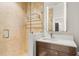 Modern bathroom featuring marble tile, a glass-enclosed shower, and a sleek wood vanity at 7 Ne Ivanhoe Blvd, Orlando, FL 32804