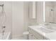 Bright bathroom featuring walk-in shower, illuminated mirror, and modern vanity at 7 Ne Ivanhoe Blvd, Orlando, FL 32804