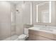 Modern bathroom with a glass-enclosed shower, a floating vanity, and a sleek, illuminated mirror at 7 Ne Ivanhoe Blvd, Orlando, FL 32804