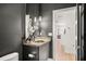 Stylish powder room features a sleek vanity with granite countertops and decorative lighting at 7 Ne Ivanhoe Blvd, Orlando, FL 32804