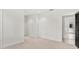 Spacious carpeted bedroom boasts a modern design and is open to the ensuite bath at 7 Ne Ivanhoe Blvd, Orlando, FL 32804