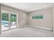 Sunlit bedroom with sliding glass doors leading to a pool view, enhancing indoor-outdoor living at 7 Ne Ivanhoe Blvd, Orlando, FL 32804