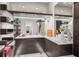 Spacious walk-in closet with custom shelves, drawers, mirrors and makeup area at 7 Ne Ivanhoe Blvd, Orlando, FL 32804