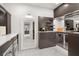 Large walk-in closet with custom storage, built-ins, and marble flooring at 7 Ne Ivanhoe Blvd, Orlando, FL 32804