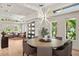 Contemporary dining area with a stylish chandelier and views of the living room at 7 Ne Ivanhoe Blvd, Orlando, FL 32804