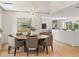 Well-lit dining room featuring open layout, stylish light fixtures, and hardwood floors at 7 Ne Ivanhoe Blvd, Orlando, FL 32804