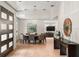 Bright dining room featuring a modern light fixture, stylish decor, and hardwood floors at 7 Ne Ivanhoe Blvd, Orlando, FL 32804