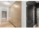 Long hallway features a wall of storage and a black door at 7 Ne Ivanhoe Blvd, Orlando, FL 32804