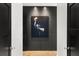 Hallway showcasing modern artwork on a dark accent wall, hardwood floors and access to other rooms at 7 Ne Ivanhoe Blvd, Orlando, FL 32804