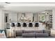 This open-concept kitchen features a large island with bar seating, a statement backsplash, and stainless steel appliances at 7 Ne Ivanhoe Blvd, Orlando, FL 32804