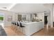 The kitchen features an island with bar seating, stainless steel appliances, light-colored countertops, and a view of the backyard at 7 Ne Ivanhoe Blvd, Orlando, FL 32804