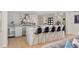 The kitchen features an island with bar seating, light cabinets, stainless steel appliances and access to other rooms at 7 Ne Ivanhoe Blvd, Orlando, FL 32804