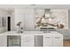 Modern kitchen features a large island with bar seating, sleek countertops, and stainless steel appliances at 7 Ne Ivanhoe Blvd, Orlando, FL 32804