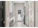 Bright laundry room with washer, dryer, and direct access to the backyard pool at 7 Ne Ivanhoe Blvd, Orlando, FL 32804