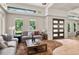 Inviting living room with expansive windows and an open concept design at 7 Ne Ivanhoe Blvd, Orlando, FL 32804