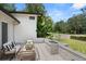 Relaxing outdoor patio area featuring a stone fire pit, seating, and manicured landscaping at 7 Ne Ivanhoe Blvd, Orlando, FL 32804