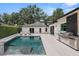 Modern backyard with a swimming pool, outdoor kitchen, and lounge chairs at 7 Ne Ivanhoe Blvd, Orlando, FL 32804