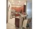 Well-lit kitchen with bar seating and stainless steel appliances at 725 Ashworth Overlook Dr # C, Apopka, FL 32712