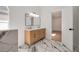 Bright bathroom with marble floors, double vanity, and modern fixtures at 7646 Coconut Creek Ct, Orlando, FL 32822