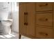 Bathroom vanity with a modern cabinet and fixtures, alongside a toilet at 7646 Coconut Creek Ct, Orlando, FL 32822