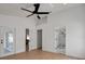 A bright bedroom with ceiling fan and views of attached bathroom and exterior at 7646 Coconut Creek Ct, Orlando, FL 32822