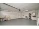 Spacious two car garage with high ceilings and painted walls at 7646 Coconut Creek Ct, Orlando, FL 32822
