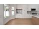 Bright eat-in kitchen features white cabinetry, stainless appliances, and a large window at 7646 Coconut Creek Ct, Orlando, FL 32822