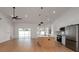 Kitchen and living area with stainless steel appliances, an island, and lots of natural light at 7646 Coconut Creek Ct, Orlando, FL 32822