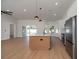 Open-concept kitchen boasts an island, stainless appliances, and ample counter space at 7646 Coconut Creek Ct, Orlando, FL 32822