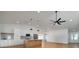 Spacious kitchen features a center island, stainless steel appliances, and hardwood floors at 7646 Coconut Creek Ct, Orlando, FL 32822
