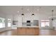 Large kitchen features a center island, stainless steel appliances, and hardwood floors at 7646 Coconut Creek Ct, Orlando, FL 32822