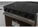 Close up of a modern black electric range oven with digital display and sleek design at 7646 Coconut Creek Ct, Orlando, FL 32822