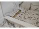 Elegant shower with marble-style tile surround and decorative drain at 7646 Coconut Creek Ct, Orlando, FL 32822