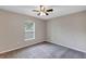 Bedroom featuring neutral paint, carpet flooring, and a window providing natural light at 8 Water Trce, Ocala, FL 34472