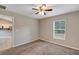 Bedroom features carpet flooring, neutral paint, a ceiling fan, and a window with natural light at 8 Water Trce, Ocala, FL 34472