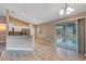 Open dining area with tiled floors, sliding glass doors to the lanai, and natural light at 8 Water Trce, Ocala, FL 34472