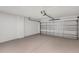 The spacious garage has a clean epoxy floor and modern doors at 8 Water Trce, Ocala, FL 34472