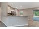 Kitchen with granite countertops, tiled floor, stainless steel appliances, and a breakfast bar at 8 Water Trce, Ocala, FL 34472