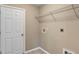 A simple laundry room has a wire rack for storage with a tile floor at 8 Water Trce, Ocala, FL 34472