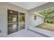 The patio has a sliding glass door leading into the home at 8 Water Trce, Ocala, FL 34472