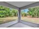 View of the backyard of the home from the screened-in patio at 8 Water Trce, Ocala, FL 34472